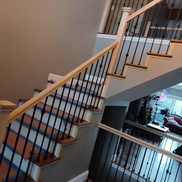 Finished staircase with iron balusters