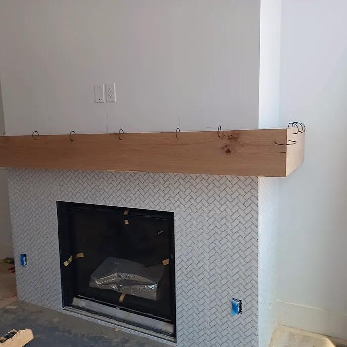 Fireplace with a timber mantel and tile surround